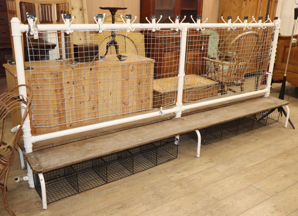 A vintage cast iron double school changing room bench, with wood seats, W.300cm D.62cm H.130cm
